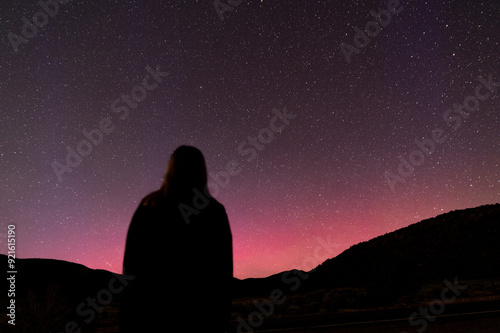 Red Aurora Borealis over Southern Utah, USA with silhouette in long exposure 