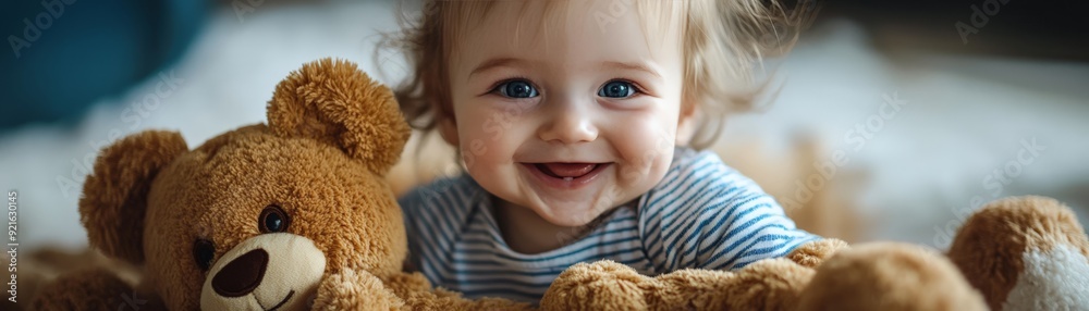 Adorable baby smiling cheerfully with a teddy bear, showcasing joy and innocence in a cozy setting. Adorable baby smiling cheerfully with a teddy bear, showcasing joy and innocence in a cozy setting.