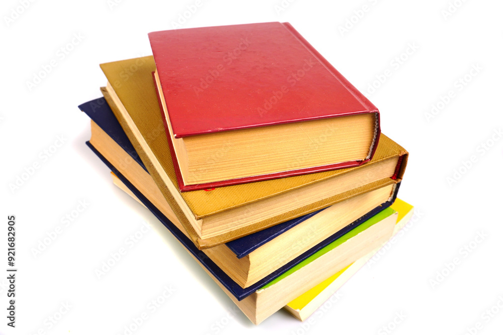 Colorful old books isolated on a white background. The concept of knowledge. Colorful old books isolated on a white background. The concept of knowledge.