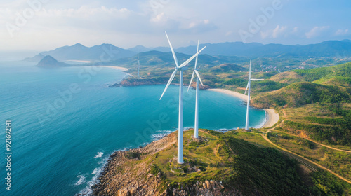 Windmills in the ocean produce electricity, providing clean energy. They are located in Ba Dong, Tra Vinh, Vietnam. photo