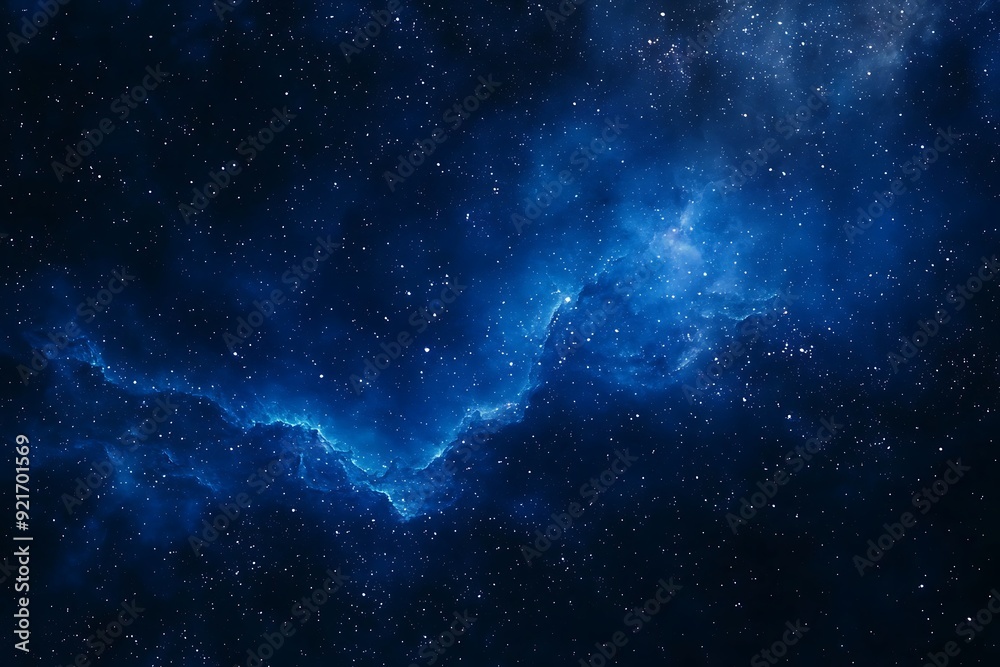 Fototapeta premium Dark blue night sky with stars and a swirling nebula in the background.