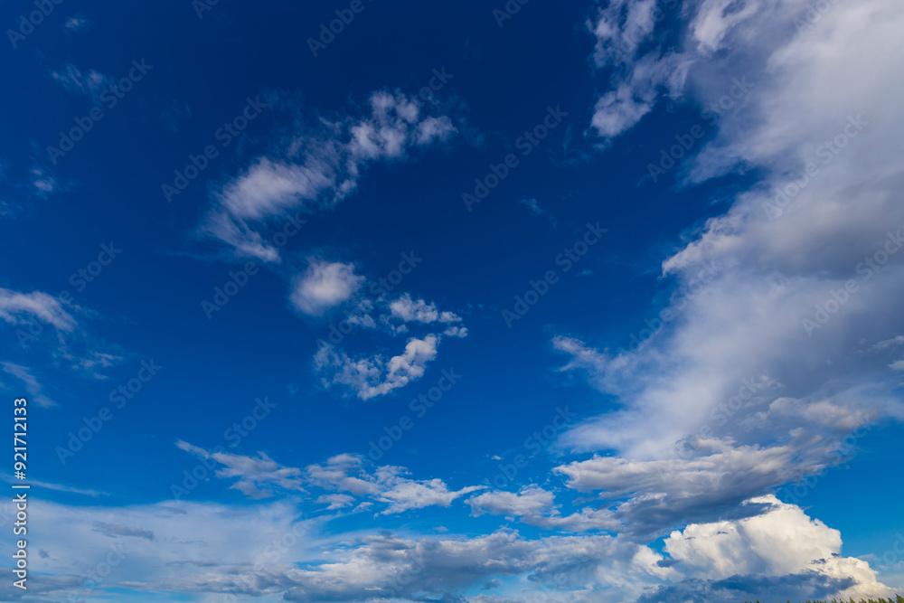 The sky is blue with a few clouds scattered throughout The sky is blue with a few clouds scattered throughout
