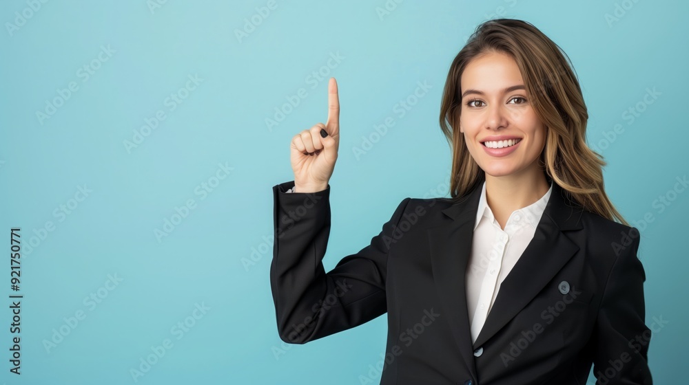 Portrait of happy smiling beautiful young woman pointing finger up, copy space. Portrait of happy smiling beautiful young woman pointing finger up, copy space.