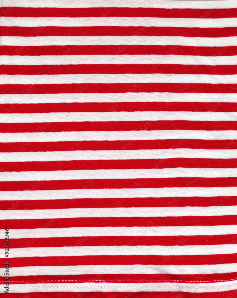 Red and white style striped fabric texture. Background with striped closeup weave fabric. Pinstripe material of red and white color Red and white style striped fabric texture. Background with striped closeup weave fabric. Pinstripe material of red and white color