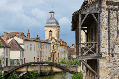 View at the Récollets Church and the Bave river in the village of Saint-Céré Lot Occitanie in Southern France under a cloudy and stormy sky in summer. photo