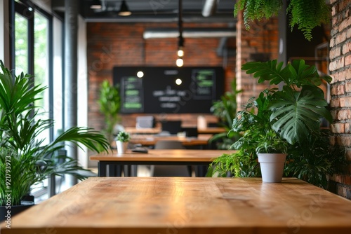 Modern open-plan office with greenery and workspace dividers