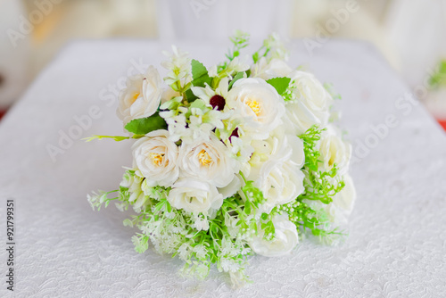 White flower bouquet, on the wedding ceremony table. White hand bouquet