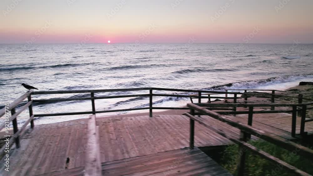 Morning Light Over Long Beach: Historic Stairs and Soft Waves at Sunrise in Iskele, Northern Cyprus Morning Light Over Long Beach: Historic Stairs and Soft Waves at Sunrise in Iskele, Northern Cyprus