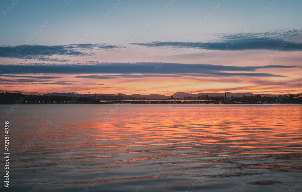 The beautiful sunset reflecting on lake burley griffin, Canberra, in the evening The beautiful sunset reflecting on lake burley griffin, Canberra, in the evening