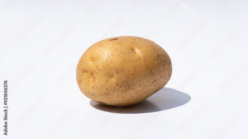 Single Fresh Potato on a Clean White Background Single Fresh Potato on a Clean White Background