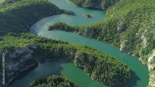 aerial view of a picturesque river meandering among the hills