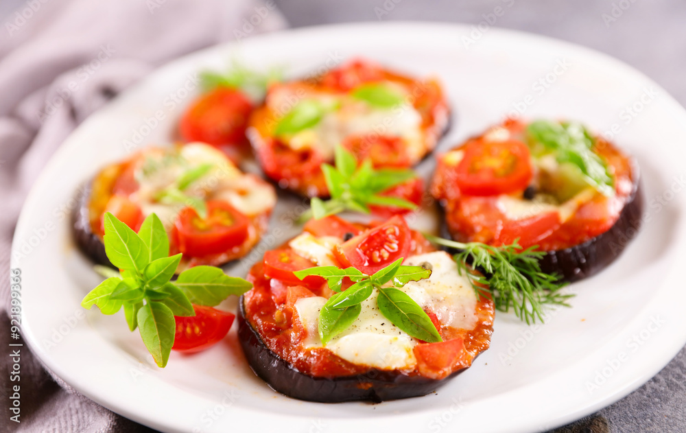 baked eggplant slices with tomato sauce, mozzarella and basil baked eggplant slices with tomato sauce, mozzarella and basil