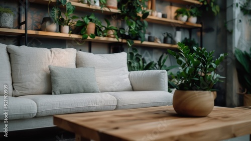 A cozy living room flooded with natural sunlight, featuring an array of green plants and a comfortable beige sofa, creating a warm and inviting environment perfect for relaxation.