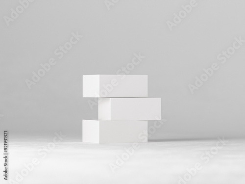 Three blank white boxes of varying sizes arranged on a clean, minimalist background. Perfect for showcasing product packaging designs, branding concepts, or minimalist product displays.