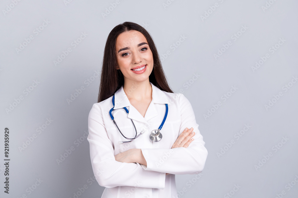 Portrait of qualified doctor woman folded arms empty space white coat isolated on grey color background Portrait of qualified doctor woman folded arms empty space white coat isolated on grey color background