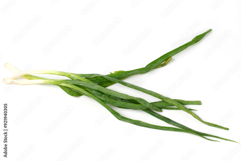 Fototapeta premium Green onion isolated on the white background, fresh leeks