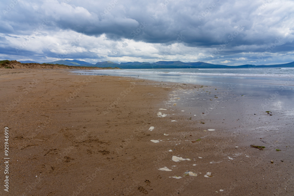 A cloudy spring afternoon on Llanddwyn beach in Anglesey, Wales. A cloudy spring afternoon on Llanddwyn beach in Anglesey, Wales.