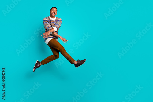 Wallpaper Mural Full size photo of nice young man jump empty space ad wear sweater isolated on teal color background Torontodigital.ca