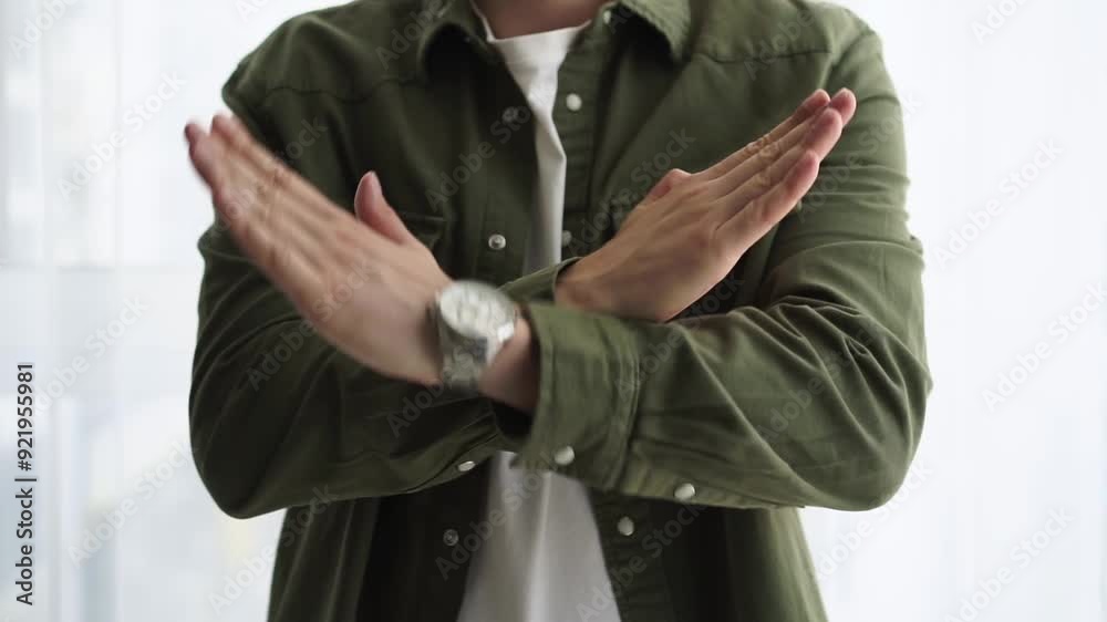The man shows a gesture of denial.
Stop, don't, stop, move away The man shows a gesture of denial.
Stop, don't, stop, move away