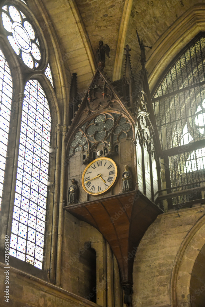 Old clock inside the cathedral of Reims in France