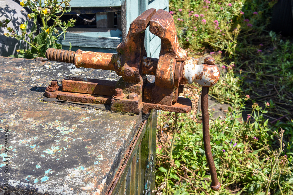 Rusty Bench Vise on Weathered Surface