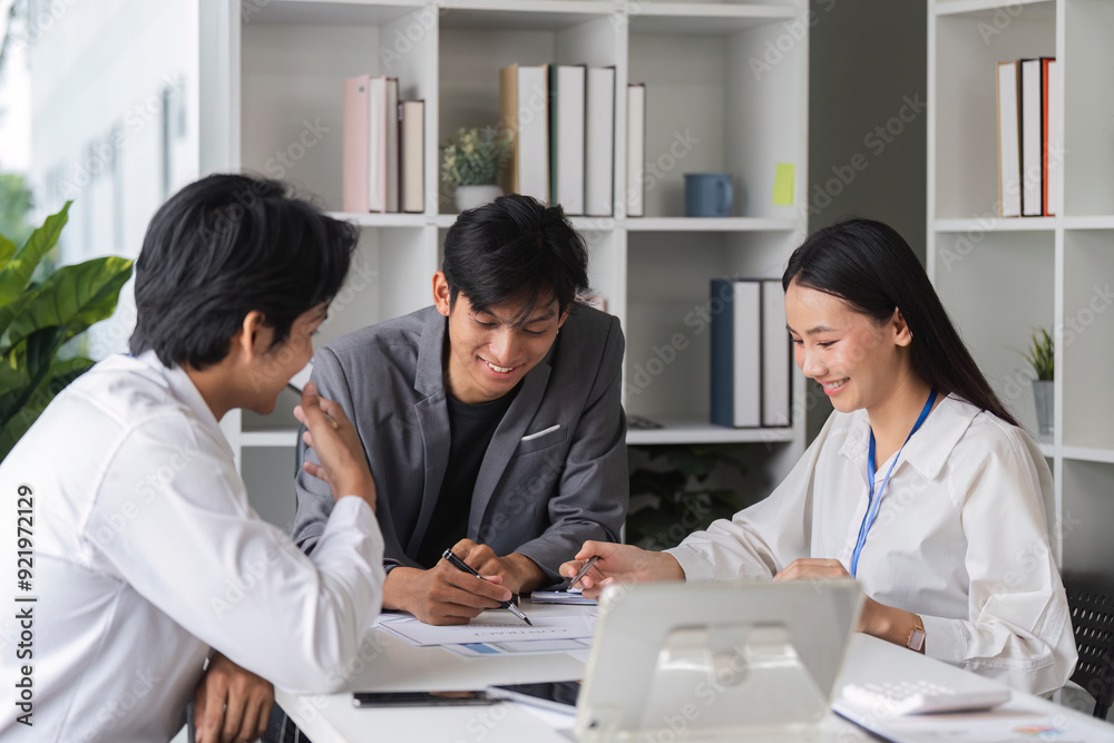 Business Team Collaborating in Modern Conference Room for Idea Exchange and Strategic Planning Business Team Collaborating in Modern Conference Room for Idea Exchange and Strategic Planning