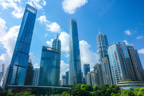 Skyscrapers Viewed from Below with Blue Sky and White Clouds