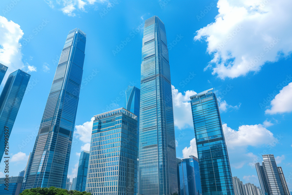 Skyscrapers Viewed from Below with Blue Sky and White Clouds Skyscrapers Viewed from Below with Blue Sky and White Clouds