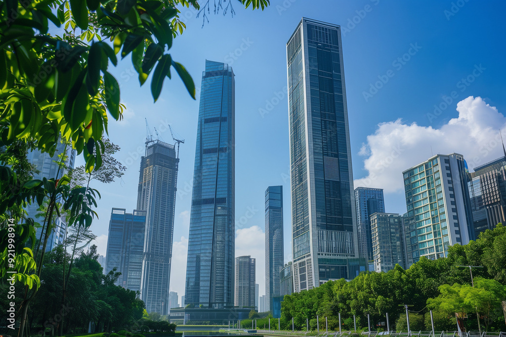 Skyscrapers Viewed from Below with Blue Sky and White Clouds Skyscrapers Viewed from Below with Blue Sky and White Clouds