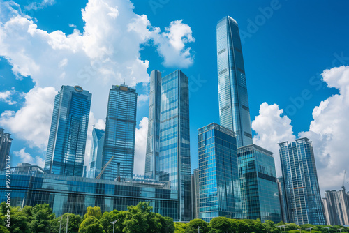 Skyscrapers Viewed from Below with Blue Sky and White Clouds