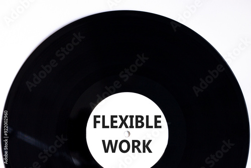 Flexible work symbol. Concept words Flexible work on beautiful white black vinyl disk. Beautiful white paper background. Business Flexible work concept. Copy space.