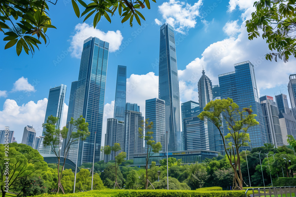 Fototapeta premium Skyscrapers Viewed from Below with Blue Sky and White Clouds
