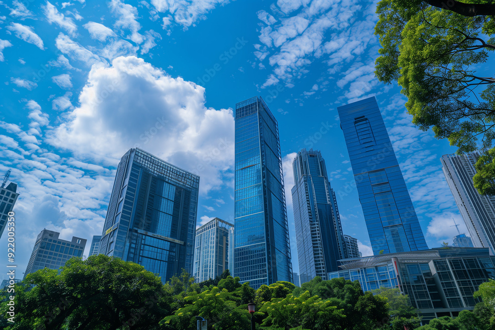 Skyscrapers Viewed from Below with Blue Sky and White Clouds Skyscrapers Viewed from Below with Blue Sky and White Clouds
