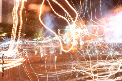 The random flashes of light from vehicle lighting and street lamps create a beautiful abstract expression.