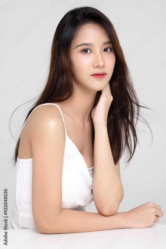 Beautiful young Asian woman with natural beauty make up style shows healthy and perfect skin on isolated background. Facial and skin care concept for commercial advertising. Beautiful young Asian woman with natural beauty make up style shows healthy and perfect skin on isolated background. Facial and skin care concept for commercial advertising.