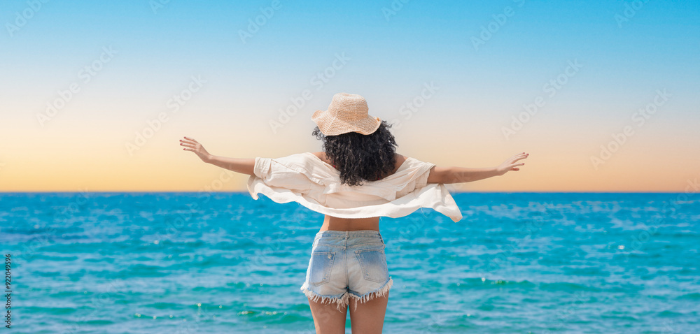 Pretty young girl on the seashore with beach hat
Pretty young girl on the seashore with beach hat