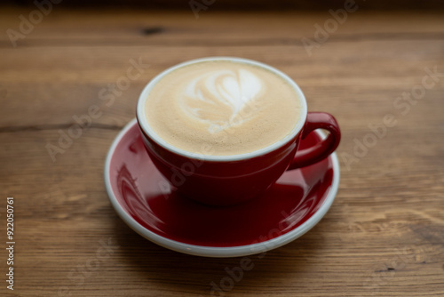 Red Mug of Latte Coffee on Wooden Table