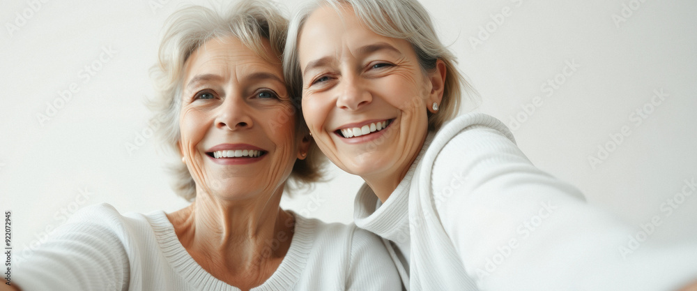 Two Senior Women Smiling and Looking at the Camera Two Senior Women Smiling and Looking at the Camera