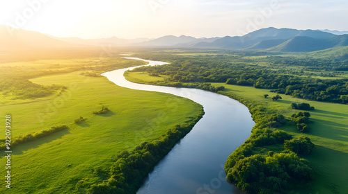 Aerial drone view of a breathtaking travel destination, untouched nature and vibrant landscapes in the golden light of sunrise. The tranquil scenery and wilderness escape for nature and adventurers.