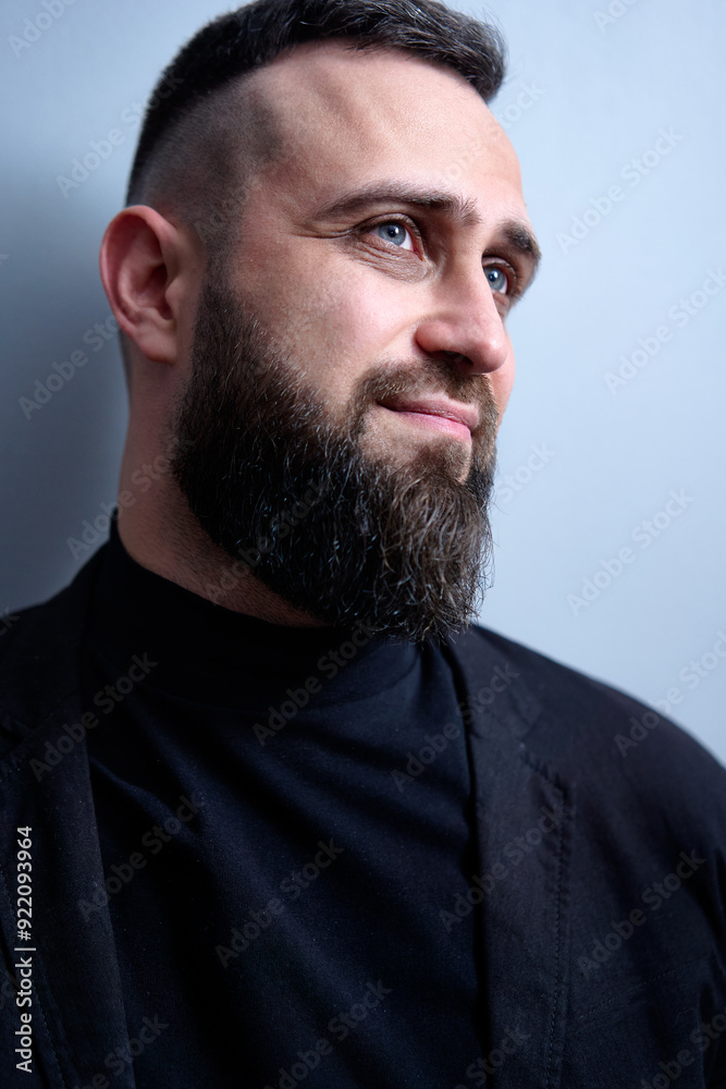 Studio portrait of young handsome man with beard. Studio portrait of young handsome man with beard.
