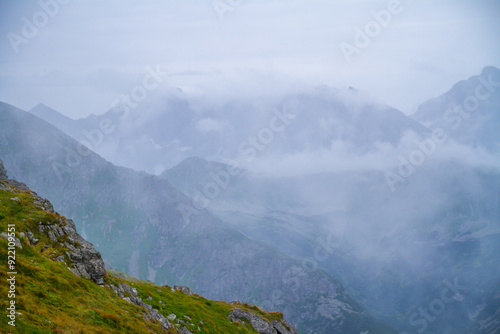 Beautiful mountain landscape with clouds and fog. 