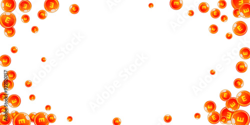 Vitamin E round capsules scattered randomly.