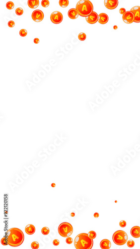 Vitamin A round capsules scattered randomly.