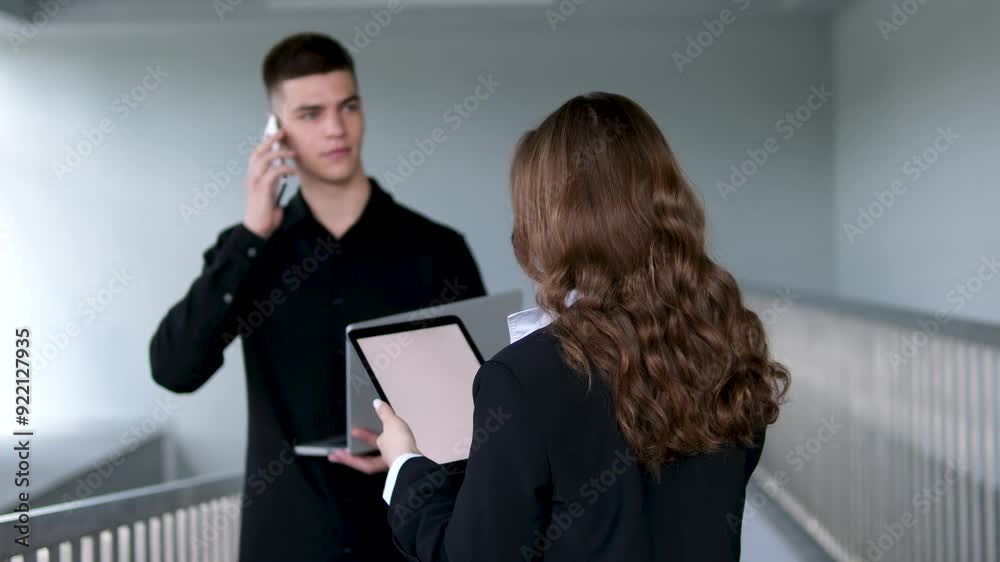 Handsome man with black hair and blue eyes. Mixed race nationality. Guy and girl at a construction site, builders foreman Handsome man with black hair and blue eyes. Mixed race nationality. Guy and girl at a construction site, builders foreman