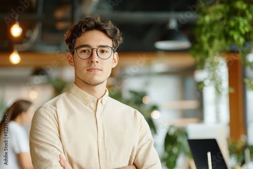 The confident programmer poised for innovation in a modern workspace, embodying creativity and determination amidst a vibrant backdrop.