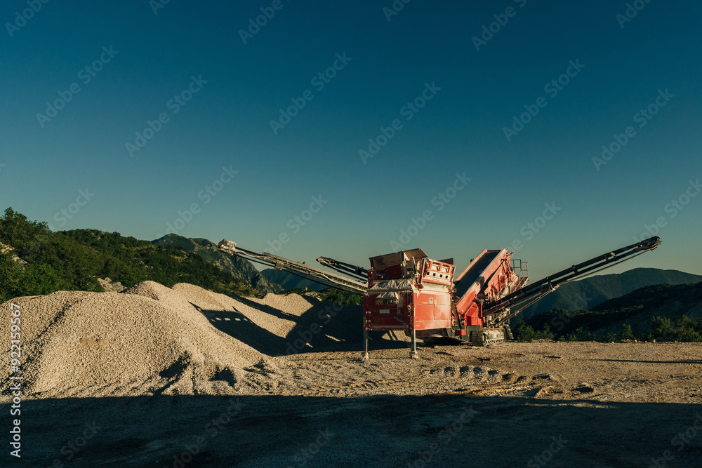 Fototapeta premium Excavators extracts the clay into open industrial quarry