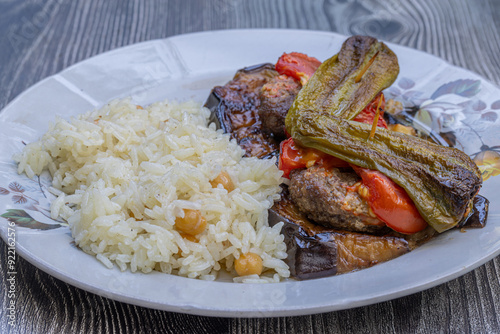 Obraz na płótnie Traditional delicious Turkish food; Kofte kebab wrapped in eggplant (Turkish name; Islim - islim kebabi or kurdan kebabi) w salonie