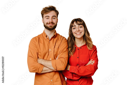 Happy Young Couple standing with their arms crossed Coordinated Orange and Red Outfits, looking at the camera and smiling Transparent Background