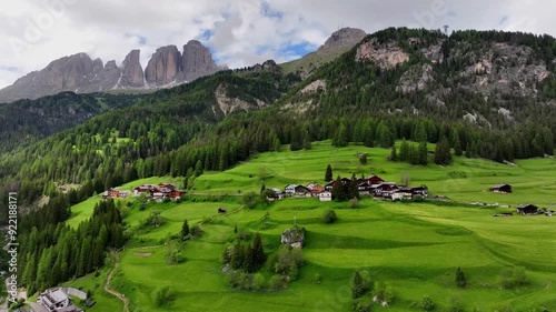Aerial view above Val di Tires, with the Catinaccio - Torri del Vajolet Rosengarten in the background, South Tyrol, Italy