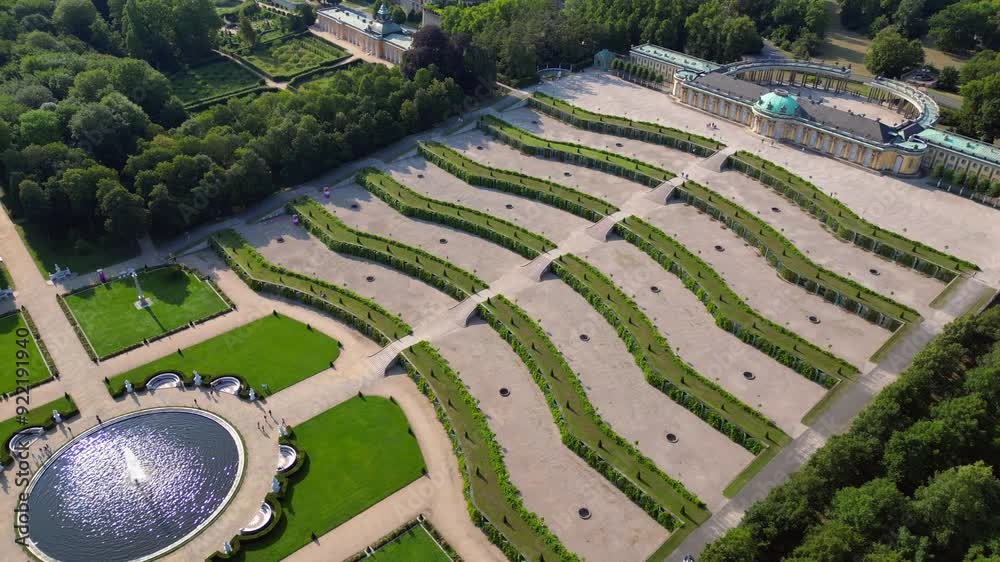 Sunny summer day Potsdam sanssouci Palace showing the beautiful green gardens and surrounding area. Best aerial view flight drone shot footage from above Sunny summer day Potsdam sanssouci Palace showing the beautiful green gardens and surrounding area. Best aerial view flight drone shot footage from above